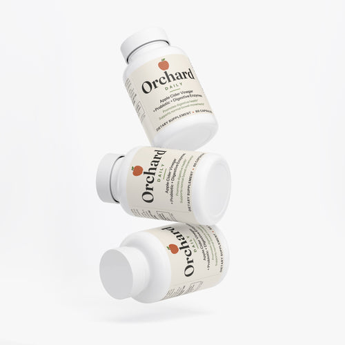 Three bottles of Orchard Daily stacked